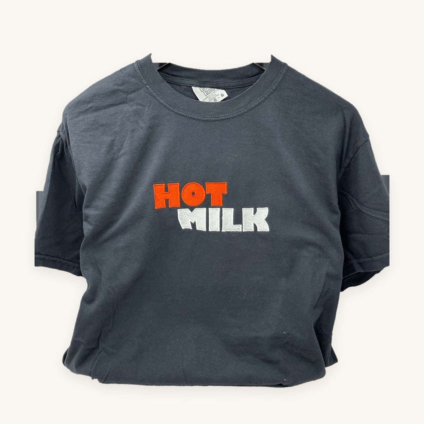Child's artwork embroidered on a navy t-shirt